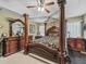This primary bedroom is a sanctuary with ample furniture, carpet, and classic décor at 7260 Se 124Th Ln, Belleview, FL 34420