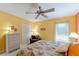 Bright bedroom with large bed, dresser and closet at 760 Hammond Pl, The Villages, FL 32162