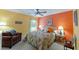 Bright bedroom with large bed, chair and bedside tables at 760 Hammond Pl, The Villages, FL 32162