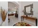 Welcoming foyer with stylish decor leading to an open living and dining area with abundant natural light at 760 Hammond Pl, The Villages, FL 32162