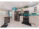Modern kitchen featuring stainless steel appliances, ample counter space, and adjacent dining area at 760 Hammond Pl, The Villages, FL 32162