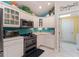 Bright eat-in kitchen features stainless appliances, including gas cooktop and microwave, and access to the laundry room at 760 Hammond Pl, The Villages, FL 32162