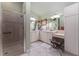 Bright main bathroom with dual sinks, shower and vanity area at 760 Hammond Pl, The Villages, FL 32162