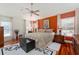 Spacious main bedroom features hardwood floors, ceiling fan, sitting area and large windows at 760 Hammond Pl, The Villages, FL 32162