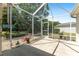 Spacious screened porch area overlooking a well-maintained backyard, perfect for outdoor enjoyment at 760 Hammond Pl, The Villages, FL 32162