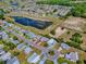 An aerial view of a single Gathering house in a quiet neighborhood at 819 Hibiscus Dr, The Villages, FL 32159