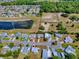 An aerial view of a single Gathering house in a quiet neighborhood at 819 Hibiscus Dr, The Villages, FL 32159