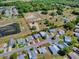 An aerial view of a single Gathering house in a quiet neighborhood at 819 Hibiscus Dr, The Villages, FL 32159