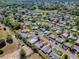 An aerial view of a single Gathering house in a quiet neighborhood at 819 Hibiscus Dr, The Villages, FL 32159