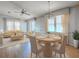 Bright living room showcasing hardwood floors, natural light, and elegant furniture at 819 Hibiscus Dr, The Villages, FL 32159
