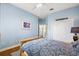 Blue bedroom featuring hardwood floors, closet, and ceiling fan at 848 Hawk Lndg, Fruitland Park, FL 34731
