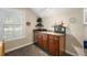 Bright bedroom nook with a built-in sink, wooden cabinets and natural light at 848 Hawk Lndg, Fruitland Park, FL 34731