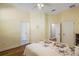 This bedroom features a ceiling fan, hardwood floors, and multiple closets and doors at 848 Hawk Lndg, Fruitland Park, FL 34731