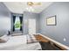 Spacious bedroom features ceiling fan, hardwood floors, and lots of natural light at 848 Hawk Lndg, Fruitland Park, FL 34731