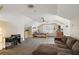 Spacious bedroom featuring a comfortable sitting area, bed, and natural light at 848 Hawk Lndg, Fruitland Park, FL 34731