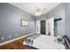 Large bedroom with hardwood floors and ensuite bathroom at 848 Hawk Lndg, Fruitland Park, FL 34731
