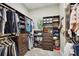 Organized walk-in closet with custom shelving, drawers, and ample hanging space at 848 Hawk Lndg, Fruitland Park, FL 34731