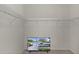 Walk in closet with shelving and a television at 9325 Se 172Nd Garden St, The Villages, FL 32162