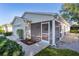 Charming home with a screened-in porch, a garage, and landscaping for outdoor enjoyment at 9325 Se 172Nd Garden St, The Villages, FL 32162