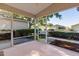 Inviting screened-in porch offering a relaxing space with views of the surrounding greenery at 9325 Se 172Nd Garden St, The Villages, FL 32162