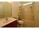 Bathroom featuring single sink vanity and tub with showerhead at 9593 Se 124Th Loop, Summerfield, FL 34491