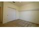 Neutral bedroom with carpeted flooring and a closet with sliding doors at 9593 Se 124Th Loop, Summerfield, FL 34491
