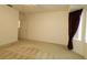 Bedroom featuring neutral carpet, ceiling fan and window at 9593 Se 124Th Loop, Summerfield, FL 34491