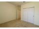 Bedroom featuring neutral walls, carpeted flooring and a closet at 9593 Se 124Th Loop, Summerfield, FL 34491