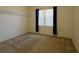 Neutral bedroom with carpeted flooring and a window with black curtains at 9593 Se 124Th Loop, Summerfield, FL 34491