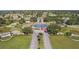 Aerial view of the community entrance with a water feature and an American flag at 9593 Se 124Th Loop, Summerfield, FL 34491