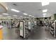 Bright gym with modern exercise equipment and floor to ceiling windows, providing a space for fitness and healthy lifestyles at 9593 Se 124Th Loop, Summerfield, FL 34491