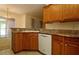 Spacious kitchen with wooden cabinets, granite countertops, and modern appliances at 9593 Se 124Th Loop, Summerfield, FL 34491