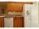 Kitchen view showcasing oak cabinets, granite countertops, and appliances at 9593 Se 124Th Loop, Summerfield, FL 34491