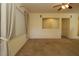 Bright living room featuring carpet, window with curtains and neutral paint at 9593 Se 124Th Loop, Summerfield, FL 34491