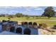 Beautiful outdoor patio offers panoramic views of the golf course and features a built-in grill and seating area at 9593 Se 124Th Loop, Summerfield, FL 34491