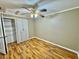 Bedroom featuring wood flooring, closet, and a ceiling fan at 10301 Us Highway 27 # 98, Clermont, FL 34711