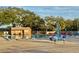 A pristine community pool features plenty of lounge seating and shade for residents at 10301 Us Highway 27 # 98, Clermont, FL 34711