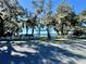 Welcoming entrance to Vacation Village, framed by moss-draped trees, creating a serene and inviting atmosphere at 10301 Us Highway 27 # 98, Clermont, FL 34711