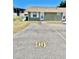 Exterior view showing ample parking space in front of a well-maintained home at 10301 Us Highway 27 # 98, Clermont, FL 34711
