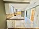 Bright kitchen with white cabinets, stainless steel sink, and updated countertops at 10301 Us Highway 27 # 98, Clermont, FL 34711