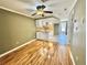 Open-concept kitchen and dining area with modern ceiling fan and wood flooring at 10301 Us Highway 27 # 98, Clermont, FL 34711