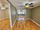 Spacious living area with new flooring and a ceiling fan at 10301 Us Highway 27 # 98, Clermont, FL 34711