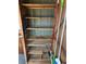 Interior view of a storage closet with wooden shelves and stored household items at 10301 Us Highway 27 # 98, Clermont, FL 34711