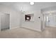 Elegant dining room featuring overhead chandelier, view to kitchen, and neutral walls at 1142 Salido Ave, The Villages, FL 32159