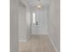 Clean entryway with neutral walls, overhead lighting, and a classic white front door at 1142 Salido Ave, The Villages, FL 32159