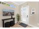 Bright entryway with natural light, console table, decorative wall art, and stylish finishes at 12129 Grand Oak Ln, Oxford, FL 34484