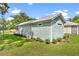 Side view of a well-kept mint home at 12129 Grand Oak Ln, Oxford, FL 34484