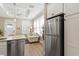 Bright kitchen with stainless steel appliances and modern white cabinets at 12129 Grand Oak Ln, Oxford, FL 34484