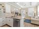 Bright kitchen with granite countertops, stainless steel appliances, and pendant lighting at 12129 Grand Oak Ln, Oxford, FL 34484