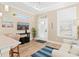 Bright living area with natural light, wood floors, and modern decor for a welcoming space at 12129 Grand Oak Ln, Oxford, FL 34484